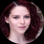 White woman Pronouns: she/her Shoulder length red hair Hazel Eyes