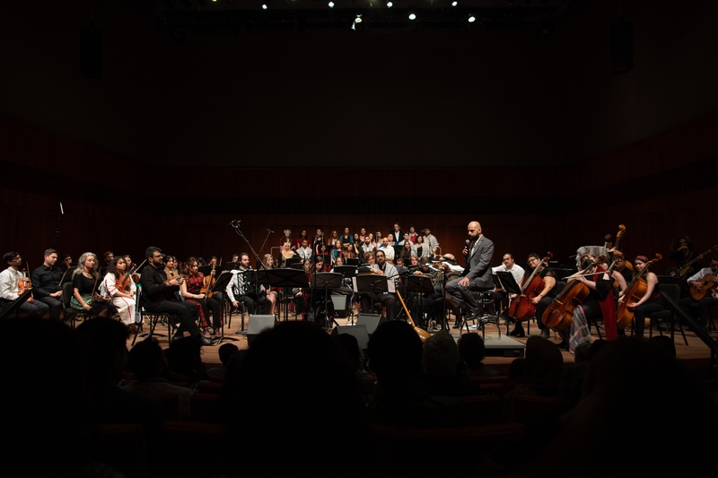  middle east music ensemble performs on stage to large crowd 