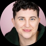 White, Queer, Non-binary Person Pronouns: They/Them Short, curly hair Glasses