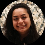 Brown/Indian woman or person with straight black hair and black eyes, wearing black jacket